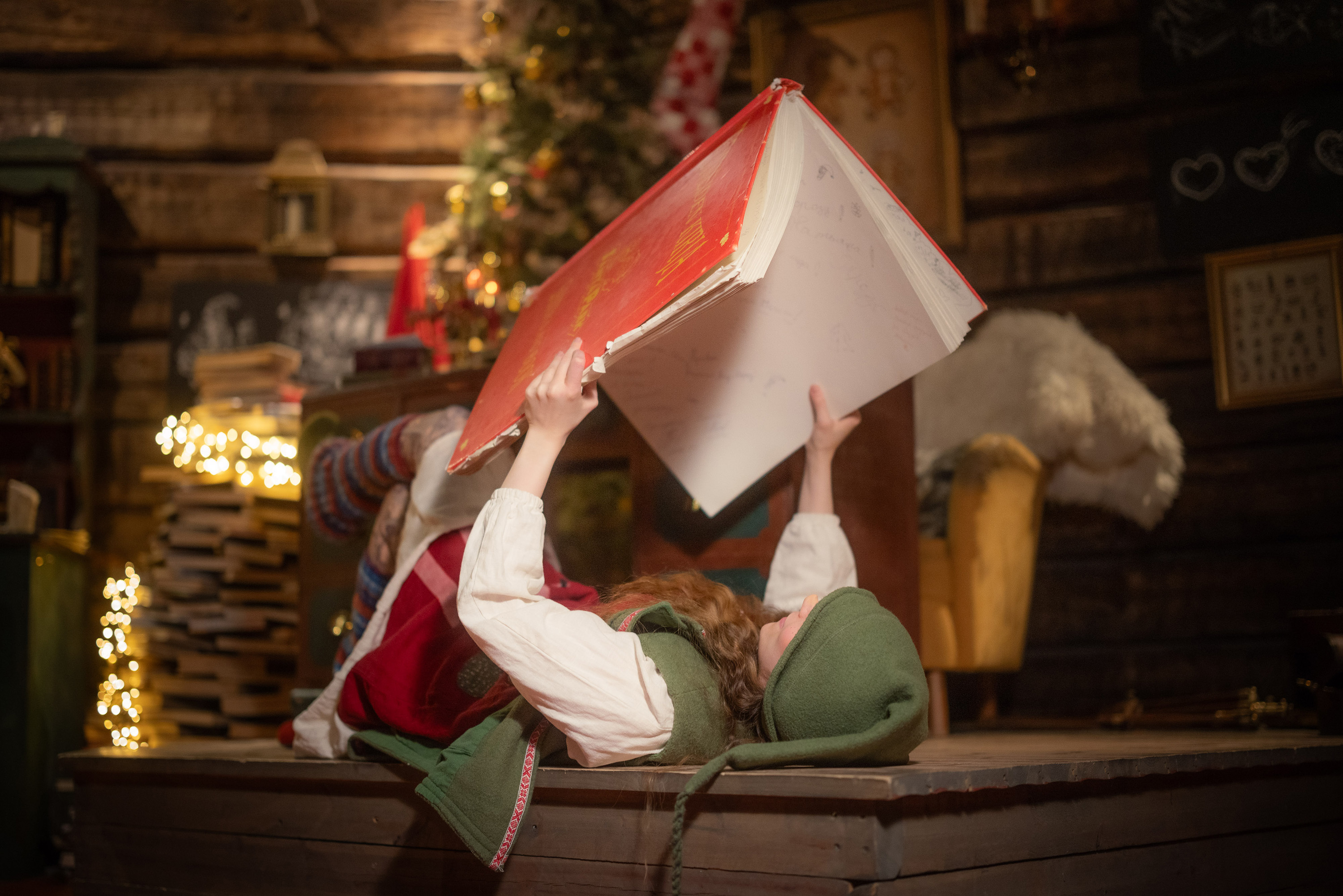 Elf enjoying some Christmas literature in SantaPark Elf School.